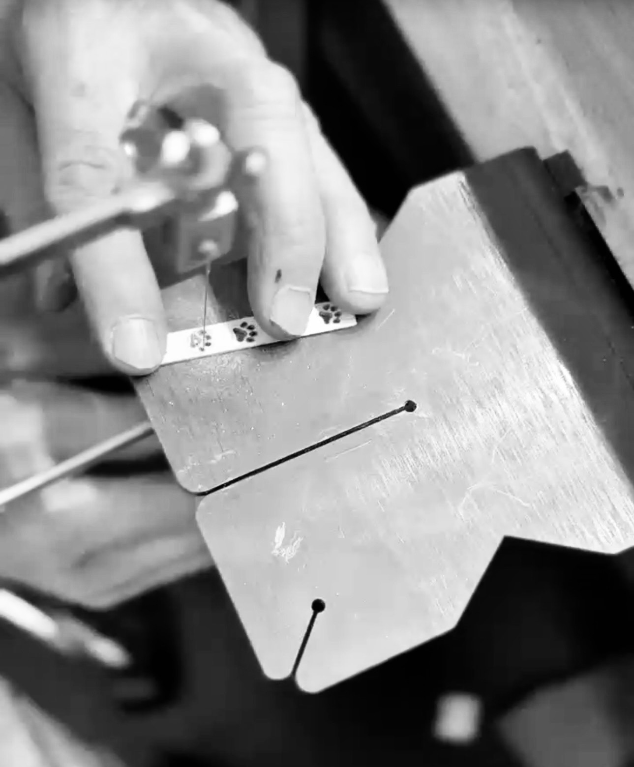 Giovanni at the bench, piercing a silver blank by hand